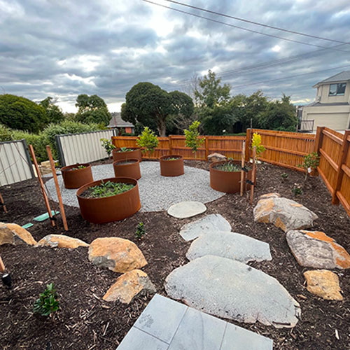 landscaping with rusted steel planters - maroondah landscapes